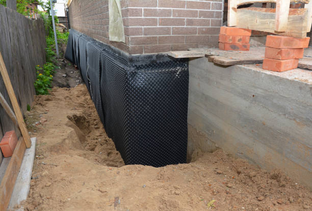 Happy homeowners after waterproofing job in Belford